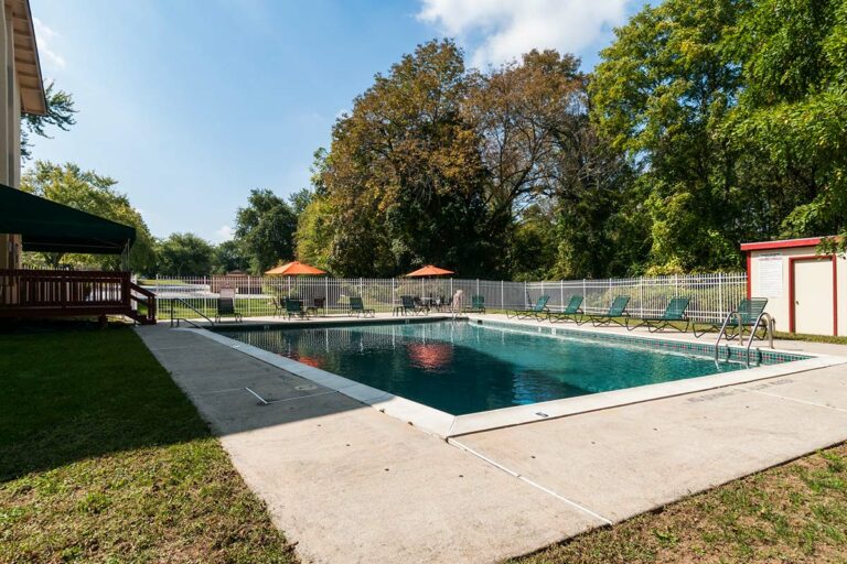 The Metropolitan East Goshen - swimming pool with lounge chairs